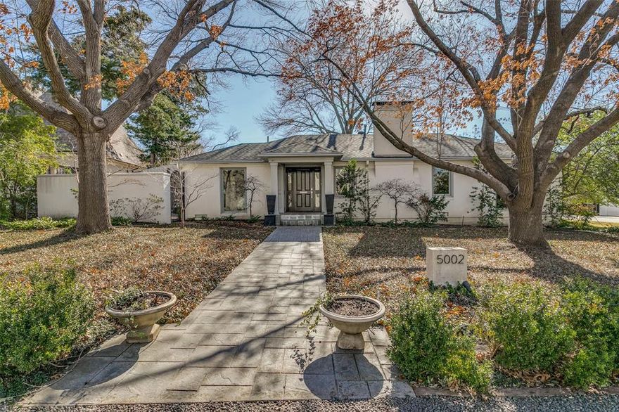 Hard to find one-story, low maintenance home in fabulous Bluffview location…this move-in ready home sits on large corner lot with mature trees and views from every window which allow natural light to fill home. Oversized living room allows for wonderful flow for entertaining with open dining room and kitchen. Home easily flows into screened-porch with built in heater and skylights. Walk outside onto large outdoor porch with plenty of room for seating or outdoor dining overlooking turfed backyard, lush landscaping, and pool with fountains.  The bedrooms are split with primary bedroom having a private, separate sitting room with views of the backyard, large bedroom with gas fireplace, large walk-in closet, and bath with separate tub and shower.  The other wing of the home houses the third bedroom, large bath, bonus room for an office or exercise, and an infra-red sauna.  The generator for the home is a bonus as is the Zen garden with fountain which is ready for koi if desired.