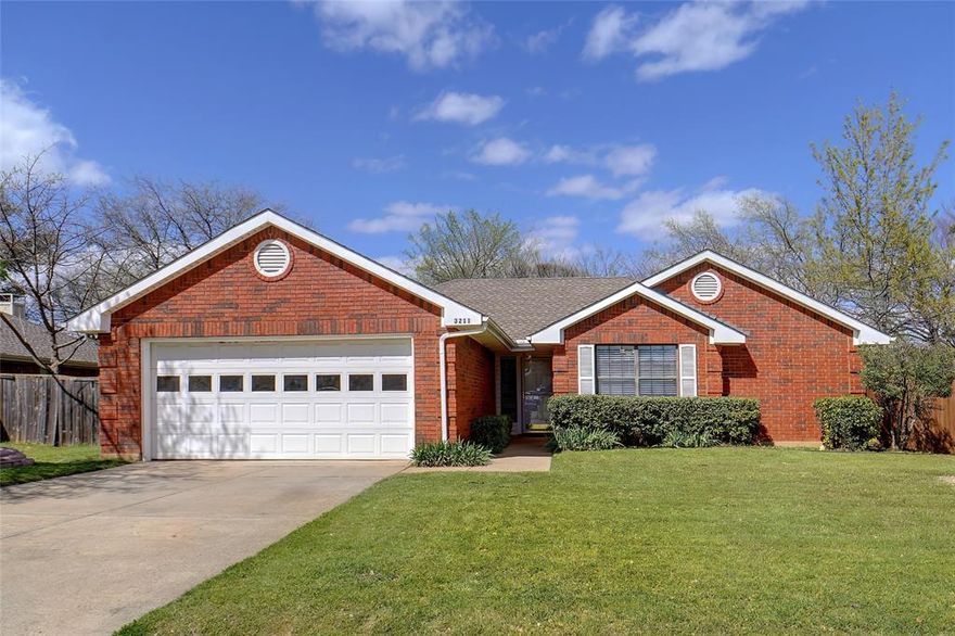 Welcome to this beautifully maintained 3-bedroom, 2-bathroom home in the highly sought-after city of Corinth! Featuring a classic brick exterior and charming curb appeal, this home offers a warm and inviting atmosphere with timeless character. Step inside to a spacious living room adorned with elegant wall paneling, a cozy brick fireplace, and plenty of natural light. The kitchen boasts ample cabinetry, crisp white countertops, and a convenient layout, making meal prep a breeze. Enjoy casual dining in the bright breakfast nook with bay windows, perfect for your morning coffee! The primary suite is a relaxing retreat with vaulted ceilings, plush carpeting, and an en-suite bath featuring a double vanity, soaking tub, and shower. Two additional bedrooms offer comfortable spaces for family, guests, or a home office. Step outside to a beautiful wooden deck, ideal for BBQs and enjoying the private, tree-lined backyard. With mature landscaping, updated flooring, and fresh neutral paint throughout, this home is move-in ready! Located in a friendly neighborhood with easy access to I-35, top-rated schools, parks, shopping, and dining, this home is a must-see!