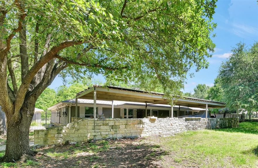 Rural living on 4.63 ACRES in the heart of the DFW metroplex! This rare find in Southwest Arlington is equidistant to Arlington’s entertainment district & to downtown Ft Worth with just a 20 minute drive to either destination via commuter highways TX 287 & Interstate 20. This is the largest piece of contiguous acreage owned by a single party within the Hidden Oaks Addition. This 2,320 SF one owner home offers 3 bedrooms, 2 baths, a 12 Ft deep pool with hot tub, detached 3 car garage with automatic doors & multiple out buildings suitable for a variety of uses such as dry storage, extra carports, private workshop, equestrian facilities or livestock pens with the appropriate ag exemption which saves thousands of dollars on annual property taxes. Consists of two individually platted parcels, 5313 & 5309 Hidden Oaks Ln. Wrought iron gate with Austin stone pillars spanning 303 Ft of road frontage along a cul de sac street invites you into a secluded oasis lined with mature trees, lush grass & your own private creek. Large Western facing covered front patio, spanning the entire width of the house, is set back 135 Ft from main entrance to alleviate road noise. Poured concrete driveway lined with mature live oaks allows a full 180 degree turnaround, ideal for staging vehicles or heavy equipment. This is your opportunity to own a slice of serenity that feels like a rural homestead just 13 miles away from downtown Fort Worth. Interior of the house is unfinished, ready for your custom renovation plans. Cost effective solar panels are owned free & clear & will convey with the sale. This is an AS-IS offering!! Buyer to confirm accuracy of all due diligence materials prior to closing and funding. No HOA. Located within FEMA’s special flood hazard zone AE. Copies of Survey, FEMA & zoning maps & general filing information regarding Tarrant County Ag Exemptions are available in TransactionDesk