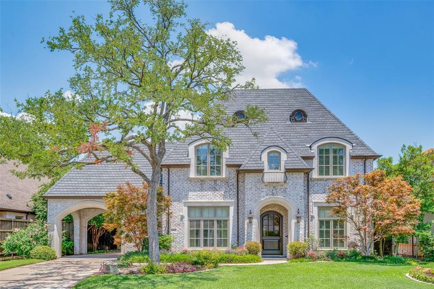 Don't miss this timeless Registry custom built home in the heart of Preston Hollow! The floorplan is ideal for family & entertaining with its elegant dining room, gracious and inviting gourmet kitchen, butler’s pantry and wine room. Recently painted & refreshed kitchen that features taj mahal quartzite counters, new hardware, lighting and remotes shades. A cast stone fireplace and functional built-ins anchor the family room with views of the pool. Your guests will love the fabulous outdoor living space with kitchen, fireplace, phantom screens and large screen TV overlooking the beautifully landscaped backyard pool and spa. The first floor primary suite is serene with a sitting area, great light and has a spa-like bathroom, abundant storage and two separate closets. The second floor is ideal for all entertaining with a spacious game room and a separate living area with entertainment center and exercise room.  Three additional bedrooms and two bathrooms are perfect for family or guests.