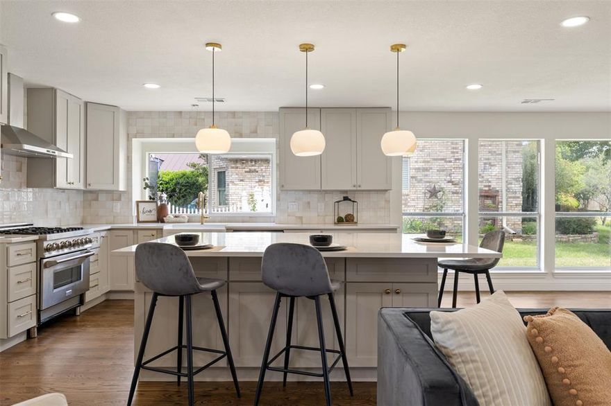 This brilliantly remodeled two-story home in Carrington Estates, located in the Breckinridge Park area of Richardson, backs up to a greenbelt with a trail for biking and walking. As you approach the house, a gorgeous contemporary front door made of natural wood with large windows greets you. This house is loaded with modern finishes! The living area is flooded with natural light and the newly resurfaced original wood floors give it a warm and classic character. The kitchen has been beautifully updated with high-grade quartz countertops, an oversized island with pendant lights, a farmhouse sink, new stainless steel appliances, a new 36-inch gas range, a modern vent hood, and soft-close cabinets. Double doors open from the living area into the game-theater room with a hall bath, both located n first floor. Escape upstairs to the oversized private primary suite with a sitting area which includes two walk-in closets and an updated en suite bathroom. All the carpet was replaced in 2025 and looks like new! Three secondary bedrooms are on the first floor. The spacious laundry room has space for a full-size washer and dryer, with room to spare. Hot Water Heater, two HVAC units, double garage door and garage door opener were replaced in 2025. The huge private backyard includes a gazebo with plenty of room for year-round entertaining; the fence and gate were also replaced and stained in 2025. An oversized back entry driveway leads to the garage!