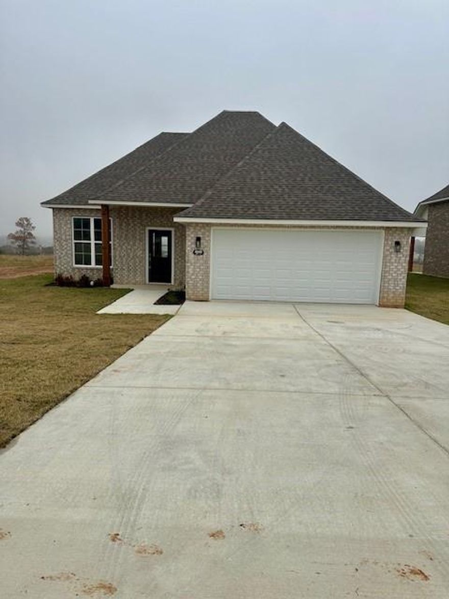 This home is located in the growing area of Blanchard, in the newer subdivision of Northwood Trace, Minutes from I-49. This under construction 3 bedroom 2 bath home features an open floor plan with granite countertops throughout, a lovely Primary suite complete with double vanities, garden tub, walk in closet and a separate shower. Kitchen features a large panty, kitchen Island with sink, and stainless steel appliances, front covered porch and covered rear patio. Don't miss out on this stunning new Home! Owner is a Louisiana licensed real estate broker