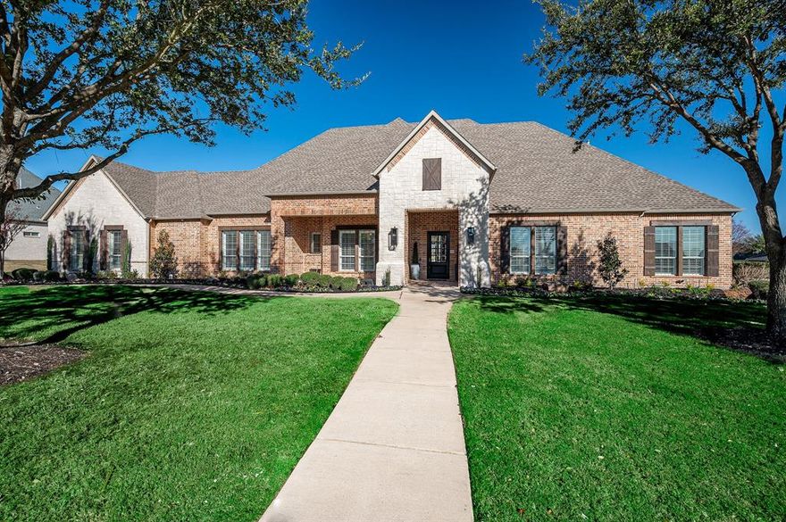 Updated Stunning single story custom home situated on a .775 acre lot in a cul-de-sac in sought after Whispering Farms in Prosper! Great Backyard designed for entertaining w-multiple open & covered patios, outdoor kitchen, fireplace, sparkling heated pool w-spa, new landscaping!All new wood plank flooring! Huge Gourmet Chef's Kitchen w-wrap around breakfast bar, island, gas cktop, dual ovens + built in fridge!Gorgeous elevation w-brick & stone, front covered porch + 4 car garage! Inside boasts thick crown molding, updated lighting, plantation shutters, Game Room,Study,Living w-floor to ceiling stacked stone FP flanked by custom built-ins!Elegant master bath!Media & Craft room up off kitchen & laundry in garage.