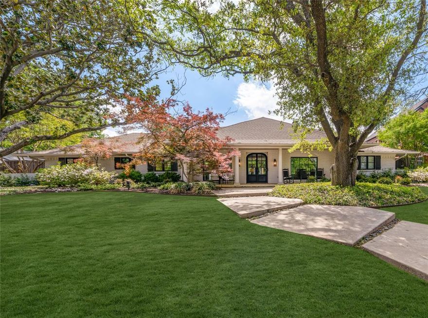 Situated on a highly desirable street in the Windsor Park neighborhood of Preston Hollow, this updated single-story Southern retreat sits on an oversized 115x145, heavily treed lot. Offering over 4,000 sq ft of beautifully curated living space, this charming ranch-style home has been extensively improved with fabulous upgrades since 2021, blending timeless character with modern updates. A light-filled entry welcomes you into spacious formals and a large den with a redone fireplace and walls of doors overlooking the backyard oasis. The updated eat-in kitchen features stainless steel appliances, a walk-in pantry, redone wet bar, and an enhanced breakfast or study area—perfect for everyday living and entertaining. The home features 5 bedrooms, 4.1 baths, and a generous game room that opens to the turfed backyard. The oversized primary suite overlooks the pool and includes an updated bathroom and dual primary closets for a true retreat experience. Step outside to your private backyard featuring an oversized patio, a pool that has been recently resurfaced with new equipment, a turf backyard with ample green space for entertaining and play, and a new gate. Additional highlights include replaced windows, spray foam insulation, newer HVAC, replaced front door, custom built-ins, updated baths, updated sprinkler system, and more. This move-in ready home offers exceptional indoor-outdoor living on a premier lot, with convenient access to major highways, NorthPark Center, and premier dining.