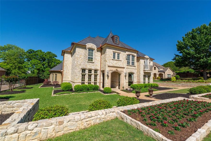 Luxury, comfort, and impeccable design meet in this stunning custom home, ideally located near major highways and perched on one of Tarrant County’s highest elevations. This thoughtfully upgraded residence features 10’ ceilings (9’ upstairs), 8’ doors, maple cabinetry, and premium surfaces including travertine, marble, granite, and onyx. The chef’s kitchen boasts granite counters, pot filler, warming oven, dual fridge hookups, and a massive 10’ x 10’ walk-in pantry. Entertain in style at the onyx-lit wet bar or relax in the spacious living area with one of three fireplaces. The primary suite offers electronic shades, custom Closet by Design system, and a spa-like bath with oversized whirlpool tub, walk-in shower with dual heads, rain head, and body sprays. Major upgrades include PEX plumbing, foam insulation, Lutron lighting, whole-house water filtration with reverse osmosis (stubbed to all bathrooms), hot water recirculation, intercom system, and a full alarm with 4 keypads. The attic offers easy access with a 4’ door and generous storage. Step outside to your private oasis featuring a pool with beach entry, remote fire bowls, sheer descents, and a full cabana with fireplace, TV, grill, fridge, and storage. A workshop with HVAC, water heater, and laundry adds incredible versatility. Additional features: electric gate, locking mailbox, touchpad entries, grade 4 imitation slate roof ($100K+), pool bath, cedar panic room, and never lived in by pets. Just a short walk to WT Parr Park and located. This home combines elegance, efficiency, and convenience in one extraordinary package. Don’t miss your chance to own it. Schedule a showing today!