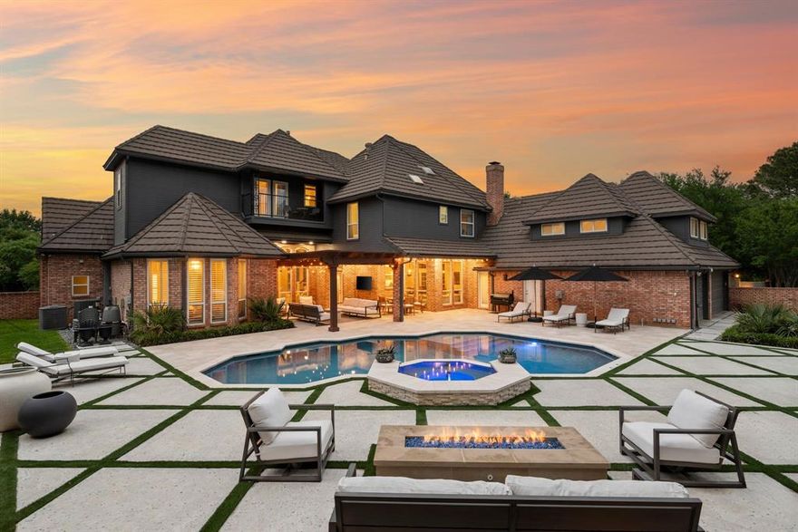 No expense was spared when it comes to the interior & exterior renovations completed for this stunning Colleyville home nestled on a rare 0.8-acre corner lot in the prestigious gated community of The Hills of Central Park. Perfectly located within the highly sought-after GCISD school district and just blocks from premier shopping, dining and DFW Airport, this home offers both convenience and elegance.  Step inside and be welcomed by beautiful flooring, custom lighting, plantation shutters, crown molding & fireplace! The private office with custom built-ins offers an ideal environment for working from home or creating your own library retreat. Multiple living areas provide comfort and versatility, while the fully remodeled chef’s kitchen shines with high end quartz countertops, dual islands, double oven, gas cooktop, custom cabinets, gorgeous backsplash and tons of natural light! The thoughtful layout includes the primary suite and a secondary bedroom with full bath on the main level! Do not miss the primary bathroom, which has been renovated with updated tile, designer lighting, leathered quartz countertops, waterfall shower with frameless glass & freestanding tub! Upstairs features three additional bedrooms, a spacious game room, and a flex space that could be turned into a wonderful media room, second office or a craft space! The outdoor space is an entertainers dream & feels like your own private resort-style oasis! As you walk into the backyard you will notice the updated pool decking, extensive stonework, travertine hardscape, smart system custom lighting and pool controls, covered patio, pergola, re-designed pool + spa, custom firepit and incredible amount of space roam and play. The board on board cedar fence creating ample privacy completes the package! If you are looking for the MOVE-IN READY Colleyville experience, this home truly has it all!