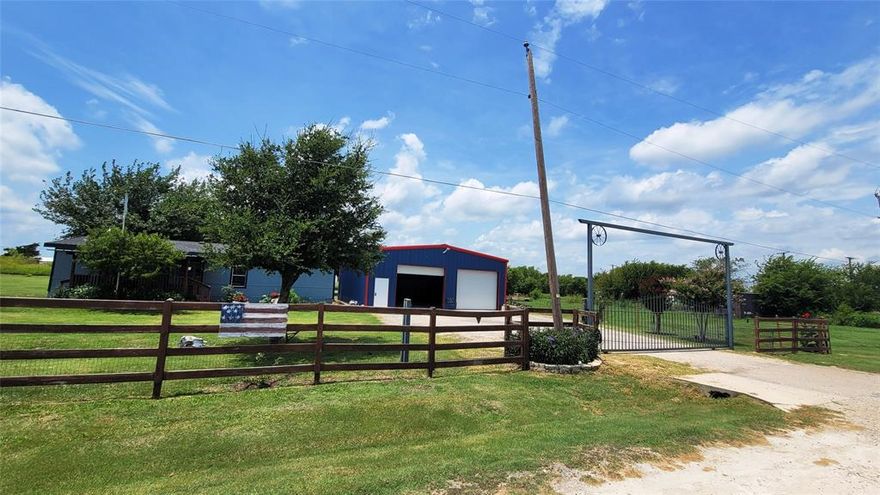 Experience the Slow Pace and Quiet Charm of Texas Country Living on this lovingly maintained Home Pride doublewide home, nestled on a beautiful 1.17-acre lot shaded by mature trees. This sweet country retreat offers the peace, space, and freedom you've been looking for—perfect for relaxing, working, or raising a family.  Central heating and air are both electric.  8x15 Front porch and covered deck patio 42x12 —both ideal spots to soak in fresh country air.  Large metal workshop (approx. 40' x 35') sits on a solid concrete slab and is fully powered—ideal for DIY projects, equipment storage, hobbies, and much more. 
The main entrance gate is electric and remote-controlled, offering both convenience and added security. For those with a love for fresh eggs or farm life, there's also a charming wooden chicken coop in the backyard.
Located just 3 minutes (0.4 miles) from Venus Elementary School, this home is perfectly situated for families seeking convenience and a close-knit community.  Don’t miss this opportunity to enjoy the beauty and simplicity of Texas country living—schedule your showing today!