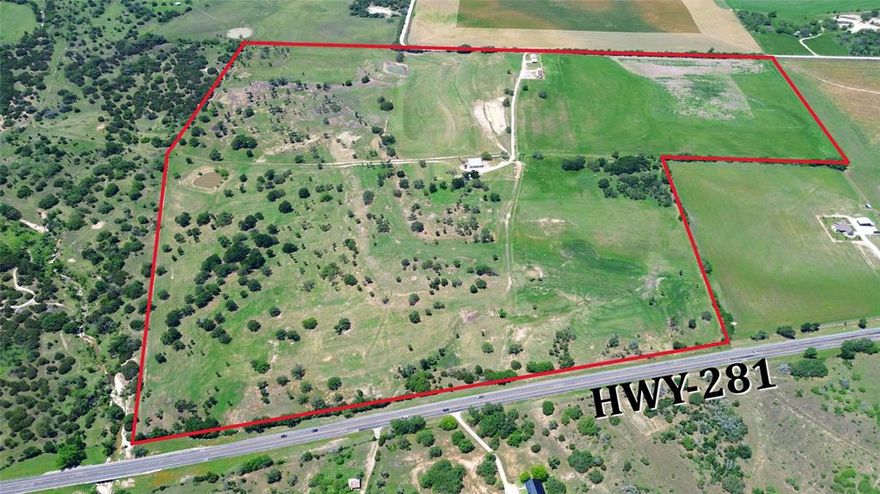 Discover an exceptional Texas Hill Country Ranch located 1.5 hours from Ft. Worth and Austin! The Ranch boasts High-Speed Fiber Optic Internet, Multi-County Water, and a 2025 installed water well, ensuring modern convenience in a serene setting. The land has been expertly cleared of mesquite and cedar, seeded with native grasses, creating lush rolling pastures. With Three large stock tanks, fully fenced and cross-fenced into four distinct pastures, the ranch is ideal for livestock or agricultural pursuits. True hunters-paradise with abundant wildlife! 
The property features significant improvements, including a beautifully remodeled 2 bed and 2 bath Farmhouse, and a stylish Texas-Inspired 2 bed and 2 bath Rock Barndominium with contemporary amenities, a spacious 40x60 metal shop, and a well-equipped campsite with two RV pads and full hookups. With over 4,000 feet of prime road frontage along HWY 281 and CR 520, this ranch offers endless possibilities—whether for development, cattle operations, short-term rental ventures, or a tranquil retreat from urban life. Embrace the opportunity to own a Turnkey Hill Country Gem, ready for your vision!