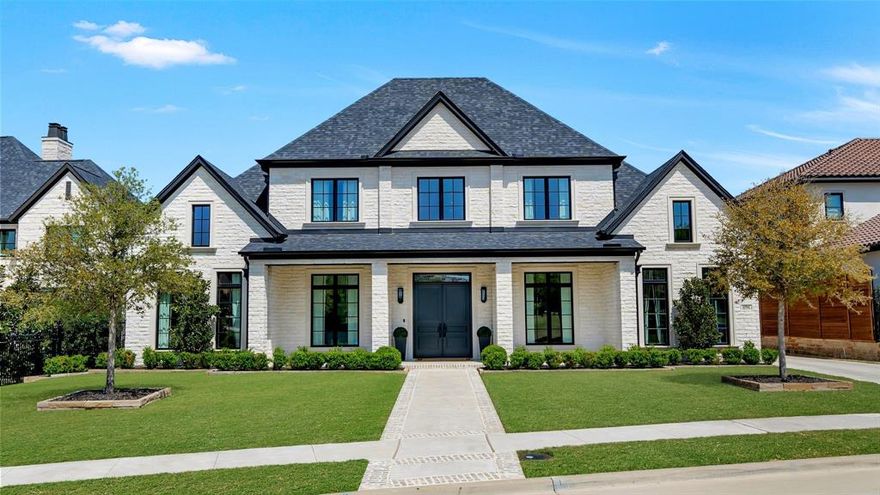 Remarkable Estate by Ron Davis Custom Homes in exclusive Eldarica enclave of Chapel Creek. Rare gem featuring oversized lot, stunning Austin stone exterior with upgraded windows and front porch complete with impressive, custom double doors. Greet guests in your stately foyer featuring 6in white oak floors in a herringbone pattern and an awe-inspiring view of the curved staircase showcasing soaring ceilings complemented by a gorgeous chandelier. The private study is richly drenched in a designer dark gray and features double doors, tray ceiling and accent wall, closet and abundant natural light from sizable windows. Wood floors flows into a spacious formal dining room with large window, impressive chandelier and adjacent Butler's pantry. Gourmet kitchen features breakfast bar island, SubZero fridge, 6-burner Wolf stove with custom hood, Blanco sink, pot filler, stunning countertops & quartzite backsplash, PLUS prep kitchen! Adjacent family room is stately with exquisite built-ins surrounding a cast stone fireplace and seamless windows offering views of the resort-style pool & serene greenery beyond. White oak floors flow into the sizable Primary Retreat boasting backyard views from a wall of windows, tray ceiling and double doors to the luxe master bath with incredible finish out including top-of-the-line stone selections, custom vanities & built-ins, soaking tub and oversized walk-in shower, plus large custom closet with island. 2nd floor features a massive game room, 3 generous-sized bedrooms w incredible ensuite baths & a flex space perfect for a gym. An additional guest bdrm downstairs w ensuite bath is positioned for privacy. The backyard is a retreat with large covered patio, motorized screens, outdoor kitchen with state-of-the-art outdoor appliances & a stunning spa-inspired pool with lounge area and treed green space behind! Secluded Chapel Creek is still just minutes from The Star, PGA Frisco and DNT, surrounded by endless retail, entertainment and dining.