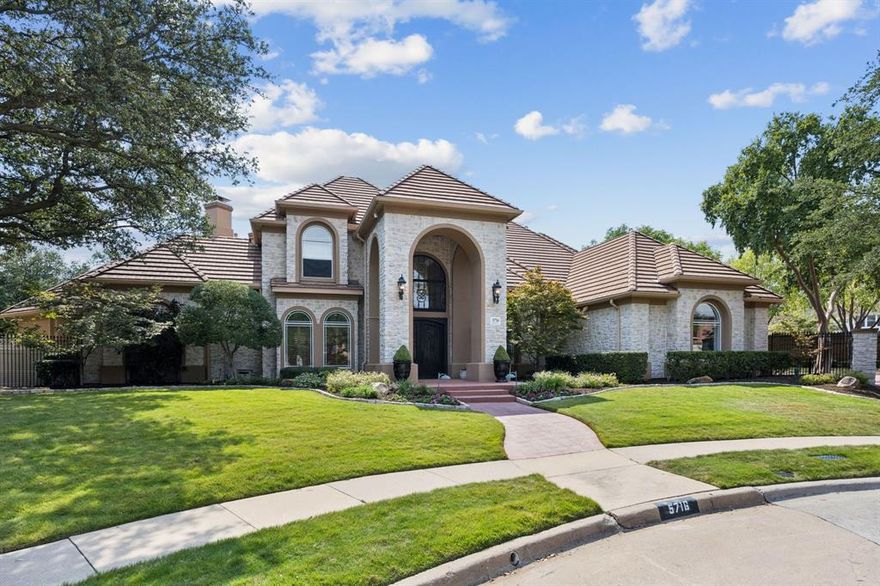Nestled on a spacious cul-de-sac lot in the prestigious Glen Lyon community, this stunning French Mediterranean residence offers 5 bedrooms, 4.5 baths, and over 5,200 sq. ft. of elegant living space. The home features hand-scraped hardwood floors, soaring ceilings, and exquisite chandeliers and sconces. A gourmet kitchen with European appliances, butler’s pantry, and large island flows seamlessly into multiple living areas, making it perfect for entertaining. The primary suite is a true retreat with a fireplace, sitting area, spa-like bath with steam shower, jetted tub, and dual vanities. Additional highlights include a library, game room, wet bar with copper sink, and multiple fireplaces throughout. The backyard is a private oasis with a heated pool and spa, gated courtyard, basketball court, and lush perennial gardens. The expansive outdoor living center takes entertaining to the next level, complete with a built-in kitchen, fireplace, heaters, automatic screens, and TV — perfect for year-round enjoyment. With a 3-car garage, award-winning Plano West schools, and an unbeatable location, this home offers the ideal blend of luxury and comfort.