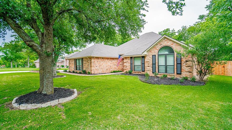 This could be the one you have been searching for! Wonderfully updated, spotless clean, and a true pride of ownership home located in the premier community of Pecan Plantation! So many wonderful features and updates at a great price! The specialties: 4 bedroom, 2 bath, 2 living, breakfast area, 2527 square feet built in 1989. Like new 2 year old roof, elegant white plantation shutters on all windows, engineered wood flooring in most areas, new carpet in the bedrooms, fresh interior paint, a spectacular newly screened in sunroom with great views out to the backyard, living room AND separate family room with a beautiful stone propane fireplace, large open kitchen with granite countertops, breakfast bar, walk in pantry, full appliances including refrigerator, propane cooktop, convection oven, built in microwave, wine cooler, washer, and dryer! Cozy breakfast area located just off the kitchen features numerous windows allowing for all the natural light you need. Super size primary bedroom has its own private access to the sunroom as well as a spectacular ensuite primary bathroom that features double sinks, garden tub, a separate shower, and an enormous walk in closet. Bedrooms 2, 3, and 4 are all split bedrooms with walk in closets and ceiling fans. Bathroom 2 also features double sinks and natural stone countertops. Throughout this entire home you will find an abundance of large windows that allow beautiful sunlight inside the home year round. Beautiful white plantation shutters on all the windows offer numerous options to open up the home completely. Outside this home is just as truly amazing as the inside! Beautiful St Augustine grass front and back yard, numerous large and mature trees throughout, extended driveway with side entry 3 car garage offering ample parking, elegant brick sidewalk leading up to the covered brick front porch, beautiful landscaping front and back yard, wood privacy fencing, chain link fenced separate dog run, propane tank, and so much more.