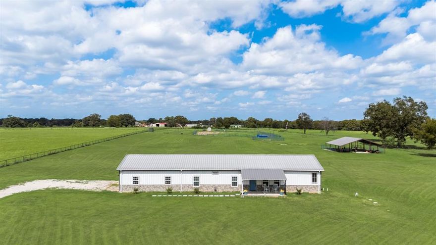 Welcome to this dream ranch retreat! This gated 10-acre horse property combines the comfort of 
modern living with top-notch equestrian amenities, just 5 miles from Lake Fork. This charming Barndo 
features 3 bedrooms, 2 baths and an open concept design. The Kitchen boasts granite countertops, SS 
appliances, and a large walk in pantry with ample space for a freezer. Relax in the cozy family room with 
a cozy FP or retreat to the primary suite with a Jacuzzi tub and oversized shower. This home was 
designed with efficiency and durability in mind. Spray foam insulation in walls an attic, metal roof, 900 
sq ft insulated garage extended for a dually truck and low electric bills, covered front and back patios 
where you can soak up the sunsets. Horse lovers and ranchers will appreciate the well-planned 
facilities:2-stall barn expandable to 6 stalls, 60x60 barn with RV hookups and covered for RV or 
equipment, Concrete wash pad 12x12, fully fenced with no climb fencing and cross fencing, 60 ft round 
pen, Roping Arena with cattle shoot and multiple lean-tos and sheds. Whether you are seeking a 
working horse ranch, peaceful country retreat, or enjoy the Texas sunsets and park your RV, this estate 
checks every box