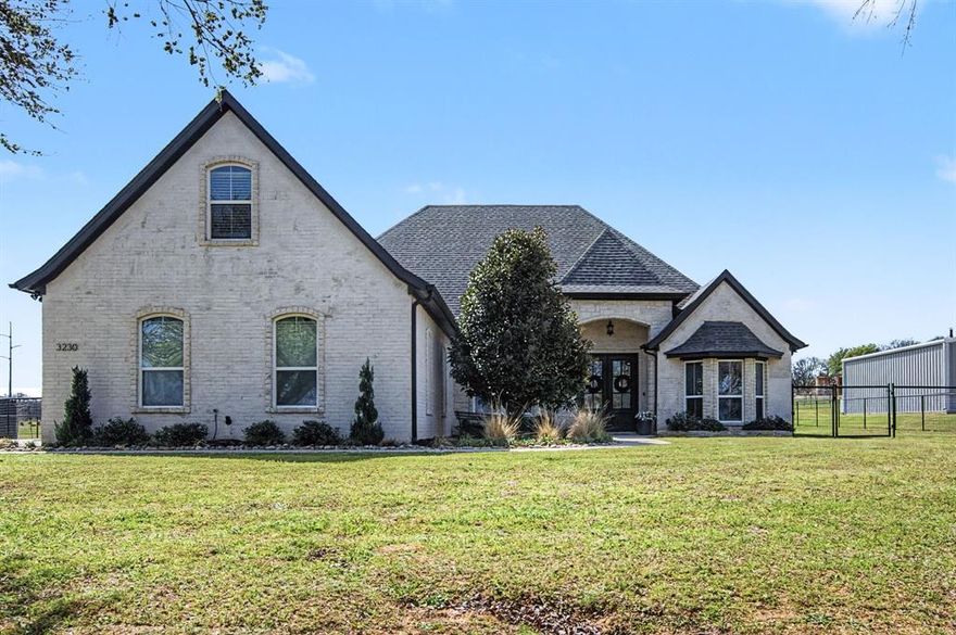 Experience glamorous country living in Springtown, TX on a beautifully maintained 1-acre lot designed for both comfort and entertaining. This modern dream home welcomes you with stunning double doors and an inviting interior highlighted by elegant wood beams and thoughtful architectural details throughout.

The spacious living area features a striking stone fireplace with shiplap accents and flows seamlessly into the open-concept kitchen, complete with modern fixtures, classic subway tile, a butler’s pantry, and a convenient mudroom—perfect for everyday living.

Retreat to the luxurious primary suite showcasing trey ceilings and a spa-like ensuite bath with a jetted tub, offering the perfect place to unwind. Upstairs, a versatile bonus room provides the ideal space for a game room, media room, or fourth bedroom.

Step outside to your private backyard oasis featuring a resort-style pool with a water slide, perfect for summer fun and entertaining. The covered patio extends your living space outdoors and includes a cozy wood-burning fireplace and wiring for a flat-screen TV—ideal for relaxing evenings or hosting guests year-round.

Enjoy the perfect blend of modern style and peaceful country living in this exceptional property.