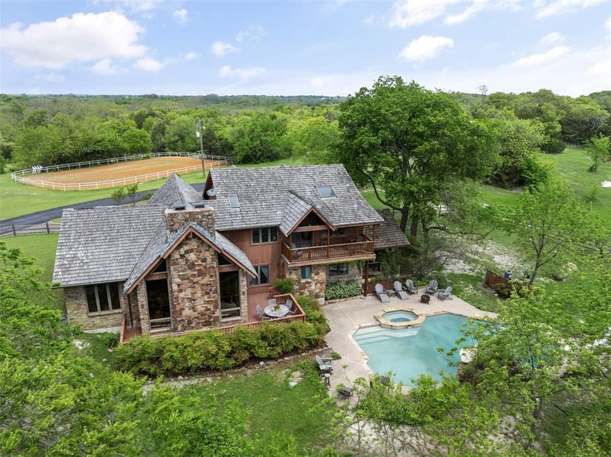 One-of-a-Kind Hillside Equestrian Chalet Estate on 59.64 Acres with 10 acre Private Pond.   
Architecturally stunning and rich in amenities, this custom-built Western chalet by architect Larry H. Walker offers the perfect blend of luxury, recreation, and equestrian functionality. 

Nestled into a serene hillside on 59.64 acres, the 4-bed, 3.5-bath home features over 2,700 sq ft of elevated living space (approx. 4,955 sq ft including decks and garage), showcasing exposed beams, vaulted ceilings, redwood siding, floor-to-ceiling clerestory windows, and a dramatic two-story rock fireplace. Granite countertops, multiple balconies, and tranquil pond views create a retreat-like atmosphere.  A true turnkey opportunity, the home is offered mostly furnished (excluding artwork and select personal items).   

The estate’s 59.64 acres include a 10-acre private pond, ideal for fishing, kayaking, and relaxing by the water.   This property is an equestrian dream with Morton-built stables featuring 8 rubber-matted stalls, groom’s office, tack room, wash rack, loft hay system, fenced pastures, loafing sheds, an iron-pipe arena with jumps.  A former cross-country equestrian course supports both training and leisure riding.

Outdoor recreation includes a renovated pool with spa, slide,  waterfall, and Italian tile, two-story playhouse, sport courts, skeet range, and abundant wildlife watching. A massive steel equipment barn includes power tools, tractors, and a loading dock—everything needed for property upkeep.  While the home and amenities are impressive, the inherent value lies in the land—59.64 acres of scenic, versatile terrain offering unmatched privacy, natural beauty, and development potential.  A rare offering, this turnkey estate blends luxury, utility, and nature with impeccable style and beauty.