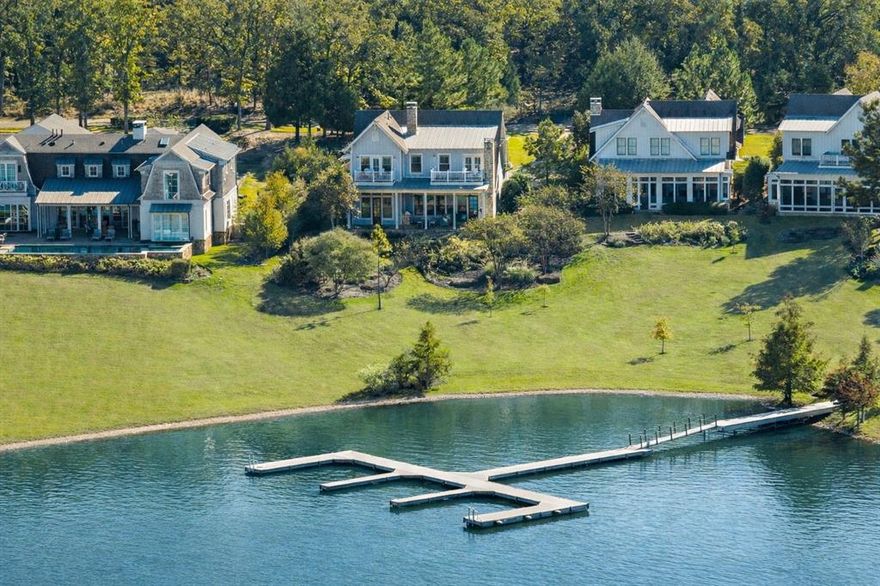 THE LONG COVE COVE EVERYONE WAITS FOR! Offered fully furnished, this home is ready to welcome its next chapter from the moment you arrive. .

Built in 2018 and thoughtfully designed to embrace its setting, this lakefront home captures sweeping open-water views and 52 feet of private shoreline. Expansive windows fill the home with natural light, while timeless architectural details and soft, coastal-inspired finishes create a sense of calm the moment you step inside.

The heart of the home is made for togetherness. An inviting chef’s kitchen with an oversized island naturally becomes the gathering place for morning coffee, late-night conversations, and shared meals after a day on the lake. The vaulted living room, centered around a warm fireplace, offers space to unwind while still feeling connected to the water just beyond the windows.

Outside, a generous covered porch overlooks the cove, where the rhythm of the lake sets the pace for the day. It’s the perfect setting for slow mornings, sunset dinners, and the simple joy of watching children and grandchildren return from the water with stories of the day’s adventures.

Life in Long Cove is intentionally designed around family, connection, and time well spent together. Located on Cedar Creek Lake just over an hour from Dallas, this private lakefront community blends natural beauty with thoughtfully curated amenities. Miles of scenic trails wind through the property, while resort-style pools, lakefront parks, sports courts, boat docks, and the beloved Toy Barn offer endless opportunities for play, gathering, and celebration.

Dodd’s Landing 13 is not simply a home on the lake. It is a place where families return, traditions are built, and memories are made for generations to come.