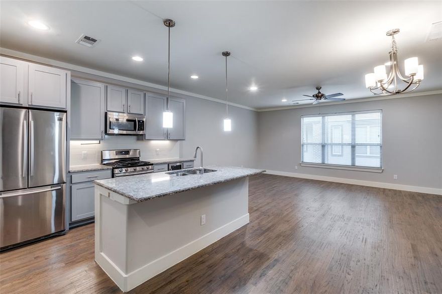 Look & Lease Special: Apply within 48 hours of touring and receive a $750 gift card after your first full month’s rent is paid! Discover this stunning townhome in the heart of Oak Lawn. Thoughtfully designed for modern living, it features soaring ceilings, pristine hardwood floors, high-end finishes, and an abundance of natural light. The open-concept floor plan includes a dedicated dining area and a spacious living room! The gourmet kitchen is a chef’s dream, showcasing stainless steel appliances, a gas range, a large island, and spacious pantry. Upstairs, generously sized bedrooms boast oversized walk-in closets and spa-inspired bathrooms for ultimate comfort. Unwind or entertain on the expansive 12' x 15' rooftop patio, complete with gas, water, and electric connections—perfect for grilling, morning coffee, or evening wine. Nestled within a secure gated community, this home offers a private two-car attached garage, manicured grounds, pet stations, and secure guest parking both inside the community and on surrounding streets. Energy efficiency, ample storage, and a prime location near trendy shops, lively bars, acclaimed restaurants, and major highways make this property truly exceptional.