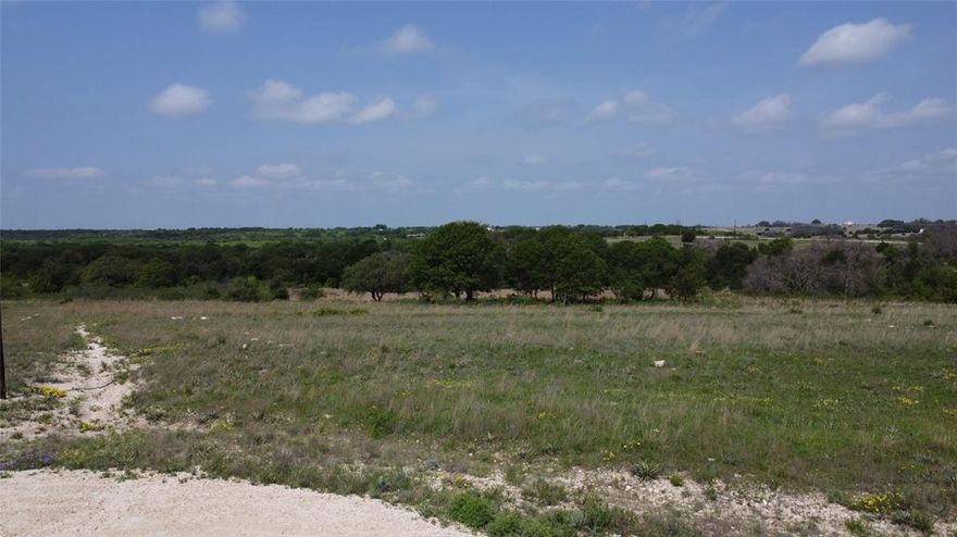 If you are looking for a build spot with endless views, look no further!  5.61 Ag exempt acres located in the Ranches at Deer Crossing offers a wide variety of opportunities.   Located to the end of the road, this very private lot offers a nice build site with a dry weather creek that runs thru the back of the property.  This lot offers native grass with a great assortment of hardwood trees towards the back.  Electric is available at the front of the property.  This would be a great investment property for future use of a residential single family, or simply do all in one and build now!  Located 7 miles from Dublin, 7.7 miles to Proctor Lake, and short 20 mile drive to Stephenville.