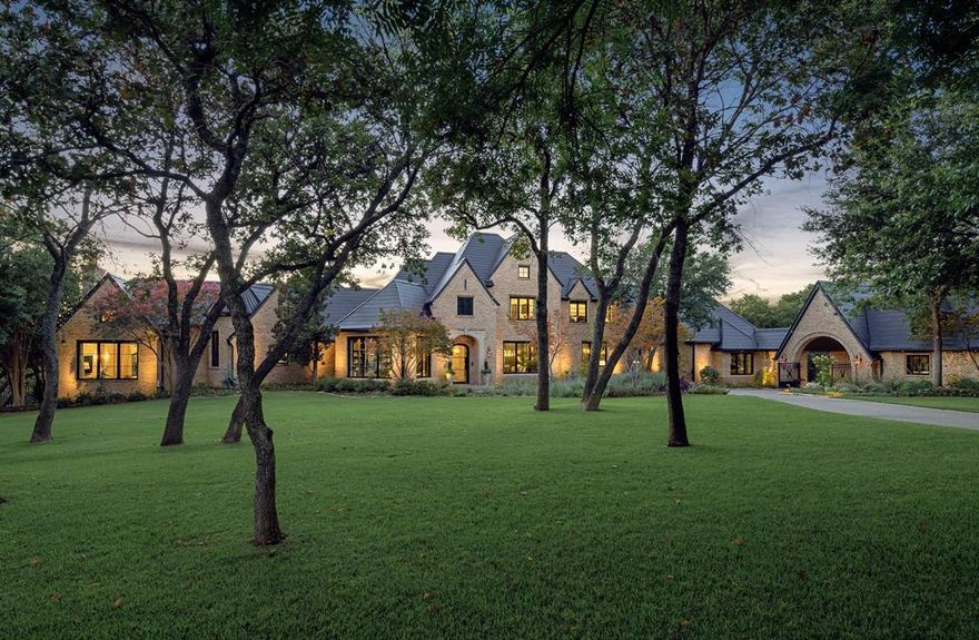 Nestled within the prestigious, gated community of The Landing on Lake Grapevine, this luxury estate epitomizes opulent lakeside living. This meticulously renovated property, which underwent a $5.5 million transformation, spans across a two-acre lot adorned with over 5,000 trees, shrubs, and perennials, crafted to evoke the charm of a classic English manor. The home itself features modern luxury with Tesla Solar Shingles, a Control 4 smart home system, and six Carrier HVAC units for energy efficiency, alongside spacious living areas like a gourmet kitchen, a great room, gym, and library. Outdoors, the estate offers spans just over two acres, including multiple entertainment spaces, including a farm-to-table garden, a pool, and direct views of the serene Grapevine Lake, making it an idyllic retreat for those seeking privacy, luxury, and a connection with nature just outside Dallas. *note we have many more pictures for additional rooms in the house available upon request!*