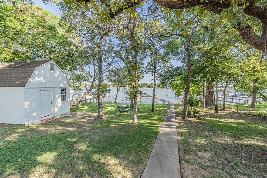 Lake Living at Its Best!

Only 20 minutes from downtown Fort Worth, this stunning 3-bedroom, 2-bath lakefront home sits on over a third of an acre in peaceful Stoners Cove on Eagle Mountain Lake. Enjoy your private dock with boat lift plus neighborhood boat ramp access.

Completely rebuilt from the studs out by a master trim carpenter, this home features updated electrical, plumbing, HVAC, and insulation, along with hardwood floors, redwood cabinetry, and custom built-ins throughout.

Relax by one of two fireplaces, including a double-sided fireplace between the primary bedroom sitting area and primary bath, perfect for unwinding in the jetted tub. The property also includes a two-car garage, shaded patio with lake views, and a 12x12 lofted storage building with electricity. The boat dock has a lift and has been updated decking and steel post. 

The House has been covered by a home warranty for several years and it is current. Just recently the dishwasher was replaced by the home warranty.
This home warranty will be extended to the new owner up to one year. 

Perfect for full-time living, a vacation home or a short-term rental investment(allowable in the Azle area), this one-of-a-kind home blends lake-life tranquility with top-tier craftsmanship. 

Listing agent offering boat tours of the cove!

Showings starting Monday April 6th.
Open House April 11th 2-4pm

Come see it for yourself.