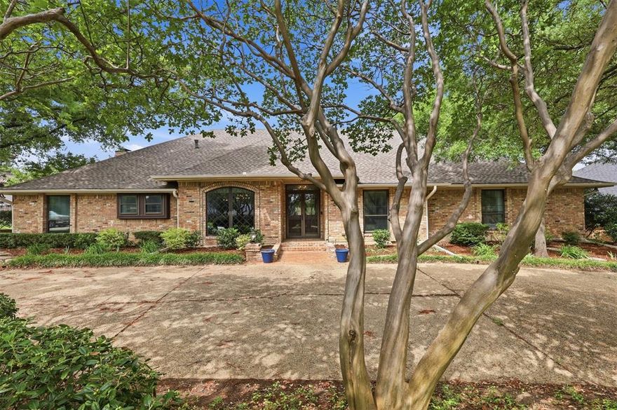 Exceptional 4-bedroom, 3 full bath, 2 half bath residence offering 3,983 sq. ft. of thoughtfully designed living with no HOA. This home is an entertainer’s dream, featuring expansive living spaces including a grand family room with a fully equipped bar and fireplace, along with a secondary living area accented by its own fireplace. The private primary retreat boasts dual walk-in closets and French doors that open to an impressive outdoor living space. The oversized patio is designed for elevated entertaining, complete with extensive space, exterior storage, and a convenient half bath. Lush landscaping with mature trees and curated flowerbeds enhances the setting. Significant upgrades include cast iron plumbing replaced in 2021, a new roof in 2024, and a professionally repaired foundation by Brown Foundation Repair with a lifetime transferable warranty (confirmed stable in 2025). the electrical is updated, upgraded and all up to code. Ideally positioned near Firewheel Town Center and major thoroughfares including PGBT (190), I-30, and 635.