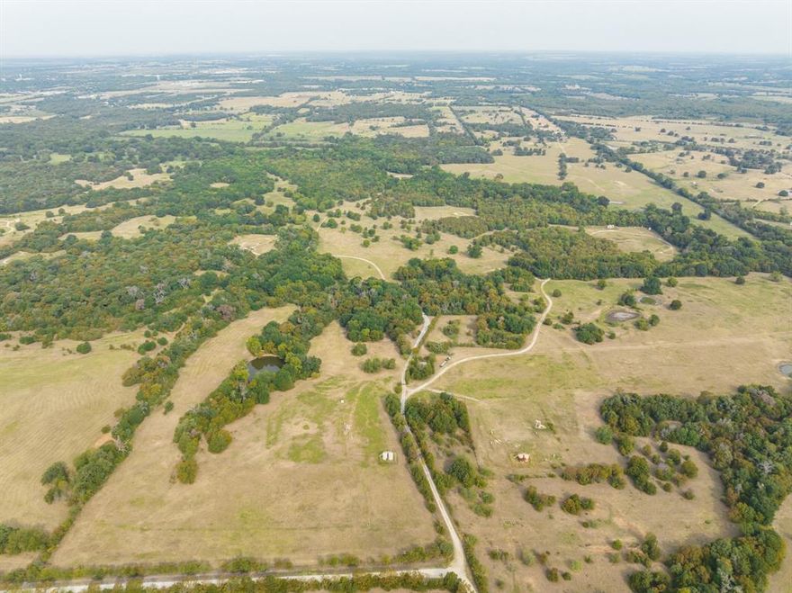NEW PRICE - $5700 PER ACRE and NEW SURVEY ON THIS BEAUTIFUL 372.67 acres FOR CATTLE PRODUCTION, HORSES OR HUNTING!! Or..... build your Dream Home on this absolutely gorgeous and rare large acreage Ranch in Limestone County! Perfect location for large Equine or cattle production business with lots of pastures to graze. Acreage is in 2 different R#s with a total of 372.67 acres. Improvements ready for a Buyer: Ag Exemption in place, fenced and cross-fenced, multiple stock tanks, cleared and groomed, scattered trees, lots of wildlife for hunting, varying topography, paved road and much more. Property lies near Lake Limestone for recreational lake life. Exact acreage is pending a survey. Some gas pads are scattered on the acreage - Mineral Rights do not convey. Buyer is responsible for confirming utilities. Lake Limestone is located about 2 hours South of Dallas and 2.5 hours from Houston.