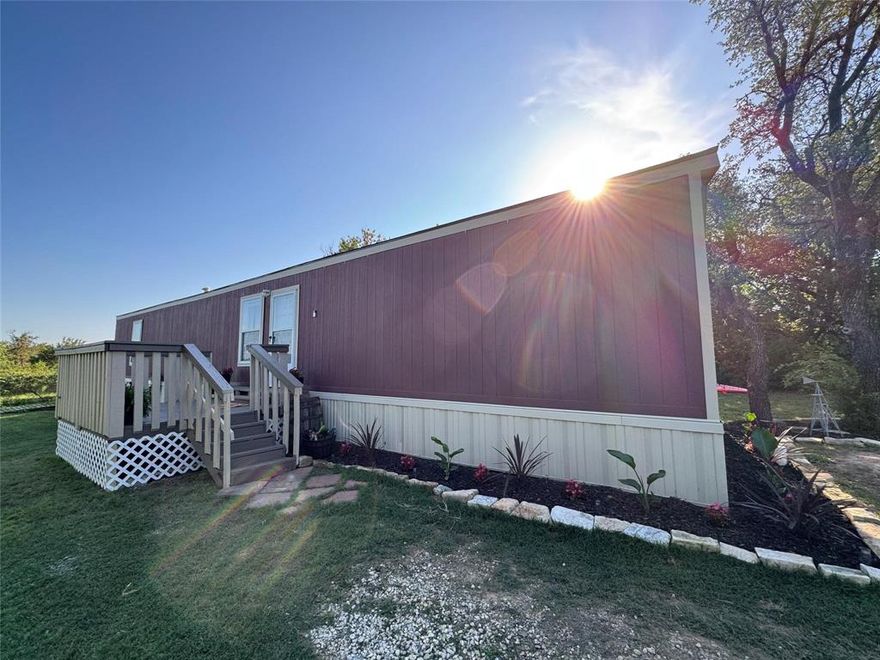 Move-in ready home waiting for its next family or great turn-key rental for investor!  This 3 bedroom - 2 full bath manufactured Oak Creek home was built in 2022.  Walk into an open living room and kitchen layout with full sized washer and dryer hook-ups.  Master bedroom has ensuite bathroom with master closet.  Secondary bedrooms are located on the other side of the home - both with generous closet space.  Outside features new flower beds, porch deck, and outdoor seating area.  Also comes with shed perfect for storing tools and lawn equipment.  Lot has been well maintained with few trees.  Perfect for first-time buyers or investors.  Will qualify for FHA and VA loans.  Home still under warranty with manufacturer.  This home can be financed - has only been moved once from dealer to lot.  Do not let this home pass you by!