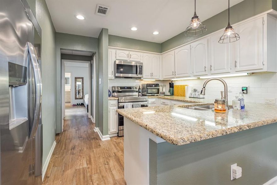 Discover this inviting 1-bedroom, 1.5-bathroom condominium nestled in the sought-after Boardwalk on the Parkway community. Built in 1982, this 985 sq ft first-floor unit offers a perfect blend of style, comfort, and practicality.

Step inside to find elegant updates, including a primary bathroom with a jetted tub, granite countertops, freshly painted cabinetry, and modern kitchen appliances. A cozy wood-burning fireplace anchors the living area, while built-in shelving, a wet bar, and abundant storage add both charm and functionality.

Enjoy outdoor living on your private fenced patio, ideal for morning coffee or evening relaxation. The home also includes a covered carport with additional storage, and residents can take advantage of a sparkling community pool and beautifully maintained grounds.

Conveniently located in North Dallas near premier shopping, dining, and major highways, this property combines low-maintenance living with comfort and convenience — a true gem in the heart of the city.