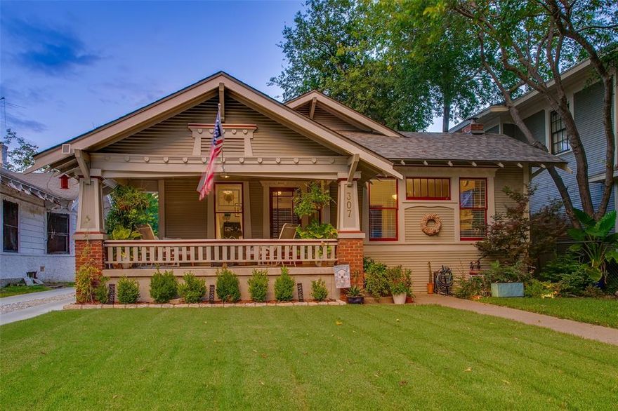 Every once in a while a home crosses your path and changes your perspective forever. This historic Winnetka Heights Craftsman home is just that: an original work of art. Seamlessly marrying the charm of the early 1900s with many modern amenities, all set in the picturesque Oak Cliff borough of Dallas. The front porch, a hallmark of the architectural style, has been featured in national publications and sets the vibe for the interior. Inside you're greeted with much of the original wood floors, still in impeccable condition, and gorgeous custom built-ins framing a newly installed and fully-functioning wood burning fireplace in the spacious living area. As you walk into the dining room, you’ll note a bespoke library ladder that ushers you to a hidden loft, ideal for a reading nook or even additional storage space. The kitchen pays homage to the street on which the home stands, with customized rose tile backsplash and an abundance of storage space. Here is where you’ll also find a secondary bonus room off of the kitchen, perfect for expanding or keeping as a home office area or mud room. Both bedrooms are generous in size with an abundance of natural light from the specialty water-glass windows. The primary suite offers dual closets, along with an en-suite spa inspired bathroom with separate shower and tub.  Out back, enjoy the recently built deck with a brand new salt water spa for all your leisure and post-workout needs, along with the expanded and beautifully cared for backyard with raised garden beds and smart water system for full ease of living at its finest! And for the cherry on top? A custom built out chicken coop will remain so you can start living your best Martha Stewart life! Welcome home.
