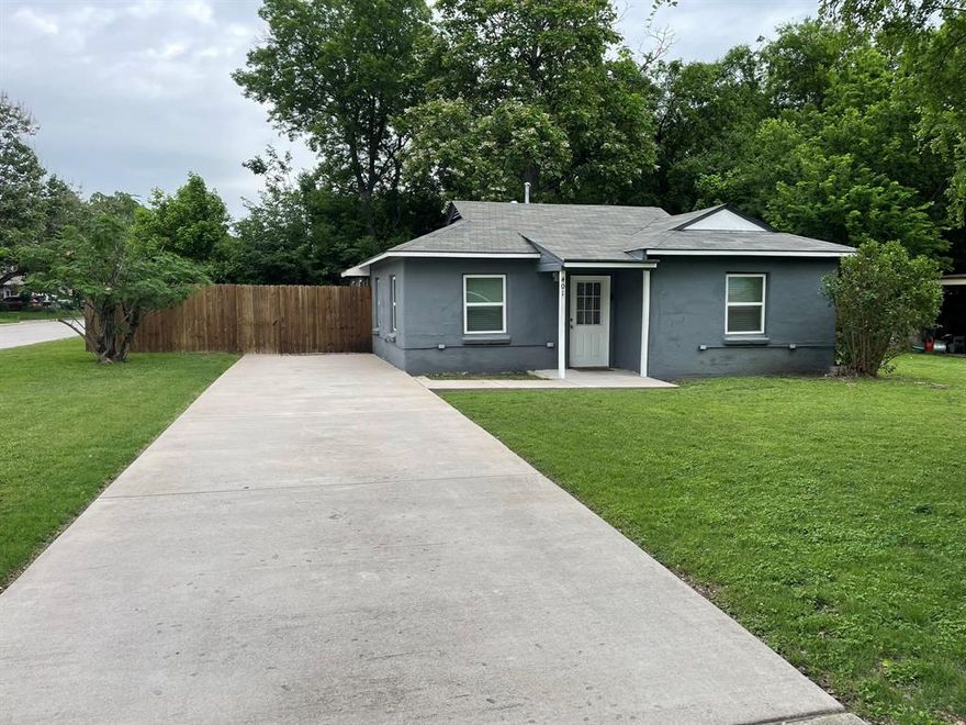 This house, situated on a corner lot, was renovated in 2021 with the addition of 360 Square feet which converted the residence into 3 bedrooms and 2 bathrooms.  The addition has the primary bedroom with ensuite bathroom, and also includes a separate laundry area and built-in shelving.  During the renovation the house was brought up to current building codes upgrading the plumbing to PEX supply lines and PVC drain lines.  All new electrical was installed with additional outlets and switches and a 200-amp service panel.  All windows were replaced with Low-E double pane single hung windows and the roof was replaced.  A new dual filtration HVAC system with programable thermostat and tankless water heater was installed.  The house is now 100% electric (no natural gas).  Other features include tile flooring throughout, five ceiling fans with light kits, custom kitchen cabinets and granite countertop, fully tiled bath tub surround in both bathrooms, venetian window blinds, six foot wooden privacy fence with gate, large mature trees, and new concrete driveway with entry walk ways. Also included are full sized clothes washer and dryer, glass top range, and refrigerator.