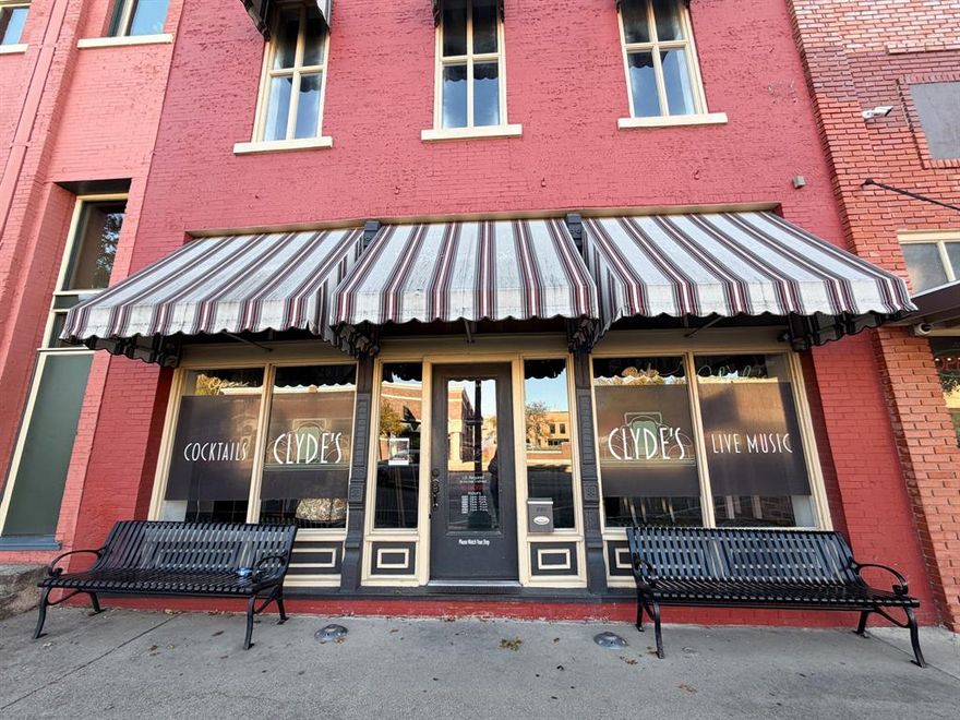 Welcome to 207 W. Ennis Ave — a charming, historic commercial space positioned in the center of vibrant downtown Ennis, TX. This beautifully preserved building blends character, warmth, and functionality, offering endless potential for retail, service, event, or hospitality concepts. The space showcases tall bead-board ceilings, exposed brick walls, concrete flooring on the main level, and a dramatic staircase leading to a wood-floored second story loft area, creating an unforgettable atmosphere for your customers or clients.The property also includes two spacious, subway-tiled bathrooms and a dry kitchen, adding convenience and utility to the space.

The previous use as a neighborhood bar means the suite includes a custom-built bar and counters that remain for re-use—ideal whether you plan to operate a bar, incorporate beverage service, or repurpose the setup creatively for retail or private business needs. Experience the energy of downtown Ennis right outside your door. 207 W. Ennis Ave isn’t just a commercial space—it’s a rare opportunity to bring your vision to life in one of the city’s most character-rich buildings.