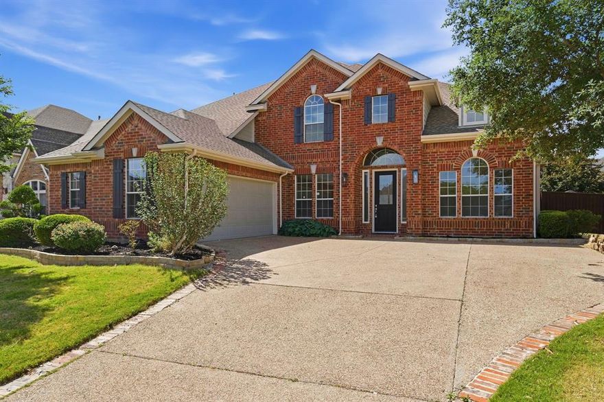 Welcome home to this beautifully refined 5-bedroom 3.5-bathroom home in Grand Park Estates where comfort & lifestyle come together seamlessly. This architecturally designed home balances open concept living & intimate spaces together for inspired daily living. When you enter you feel the soaring ceilings & beautiful curves of the staircase showcased in the Grand Foyer. Perfectly placed windows throughout the home flood refreshing natural light on perfect display when you enter into the family room. The chef-inspired kitchen overlooks the family room keeping everyone connected, with plenty of space for daily family living, entertaining guests & includes a desk niche for parents organizing & managing family life. The dining room & butler serving area is the perfect setting for special celebrations, holidays guests, and with family & friends alike. Off the Grand Foyer, find the perfect setting to create your office, library, reading or listening room, etc. The primary suite is a true retreat, offering comfort and privacy. The recently updated primary bathroom showcases floating vanities, freestanding tub, beautiful natural tile, a frameless glass shower, updated fixtures, and a large walk-in closet. Upstairs, a bonus loft area provides flexible space for a game room, media area, or children's play area with an offset study niche for learning & discovery. Four additional bedrooms and two full bathrooms ensure plenty of room for family or guests. Outside you will find a great place to relax beneath the custom trellis in a backyard awaiting your creative influences with plenty of space for a pool, expanded outdoor living with cooking center, above ground gardens OR all three. Families have a great benefit of Top-Rated Award-Winning schools. Enjoy immediate convenient access to World Class Shopping, Dining & Entertainment, Lakes, Hiking, Biking, Camping & more in Flower Mound, Highland Village & Dallas & FT Worth. When it's time to travel DFW Airport is only minutes away.
