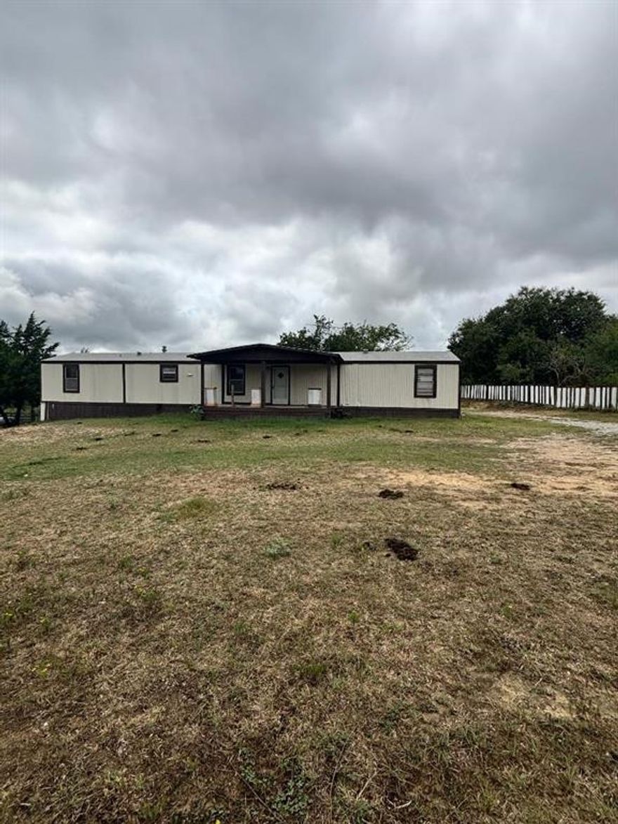 Three bedroom, 2 bath single wide on 2.4 acres, ready for a new family! Split bedrooms with master bedroom and full bath behind kitchen, opposite side has 2 bedrooms and full bath. Kitchen and living are open. Full washer dryer space off kitchen.  Horses allowed!