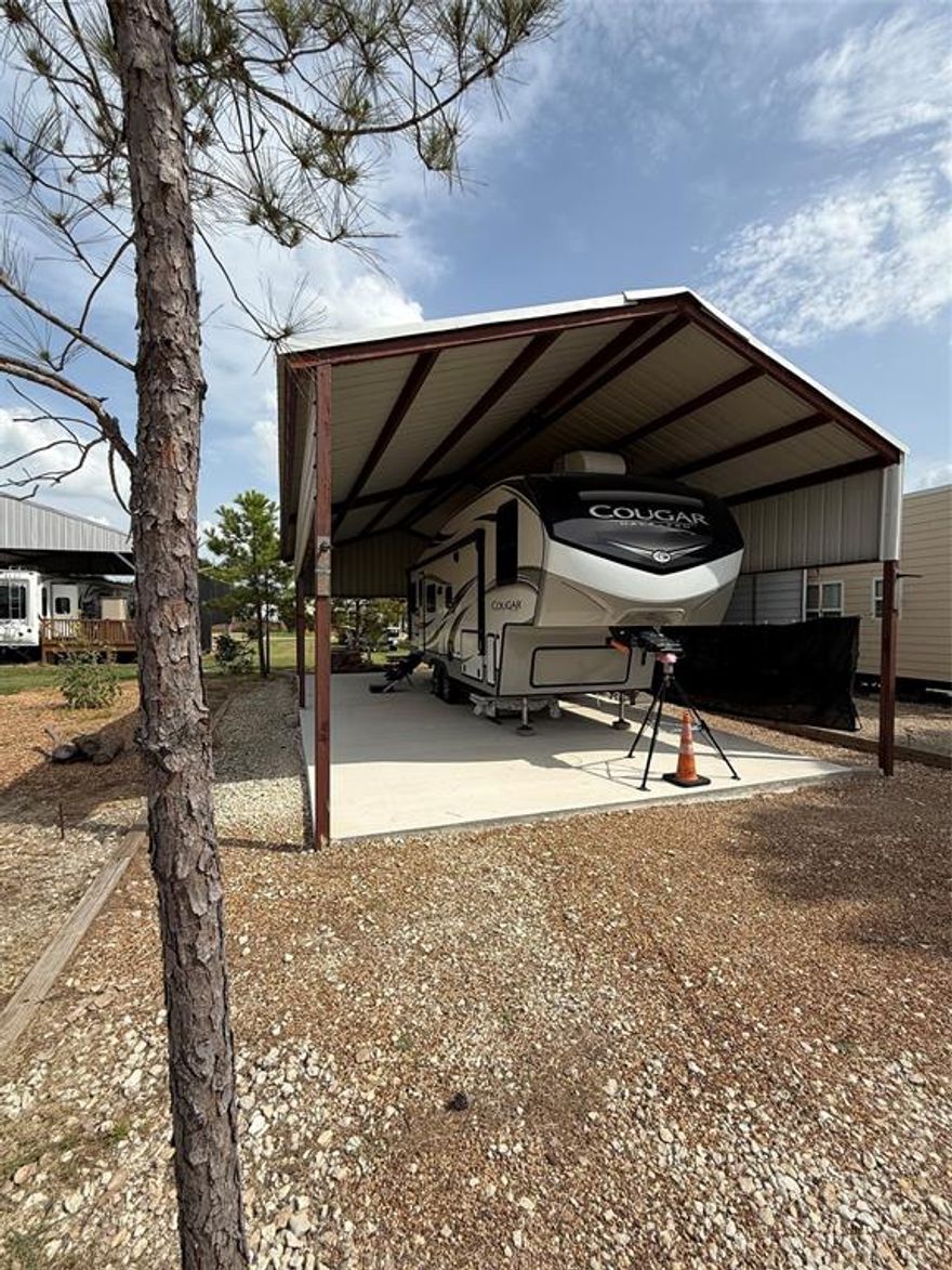 Enjoy lake living at its finest in this beautifully improved RV lot in the gated Pelican Isle community on Richland Chambers Lake. Situated on Lot 8, Block 4, this property features a high-quality 20x40 metal cover with concrete pad — perfect for protecting your RV, boat, or lake toys from the Texas sun. The lot is fully ready with underground utilities, co-op water & electricity, and gravel drive with concrete pad already in place.

This is more than a lot — it’s a lifestyle! Spend your days fishing, boating, and relaxing just steps from the lake. The property includes access to the community boat ramp, private marina, clubhouse, pool, picnic pavilion, and RV and boat storage. It’s also short-term rental friendly, making this an ideal weekend getaway, investment, or seasonal home base.

The subdivision is gated, well-maintained, and golf cart friendly, with friendly neighbors and a true vacation vibe. Located just 1.5 hours from DFW, this is your chance to own an affordable slice of lake life in one of Richland Chambers’ most desirable RV communities.