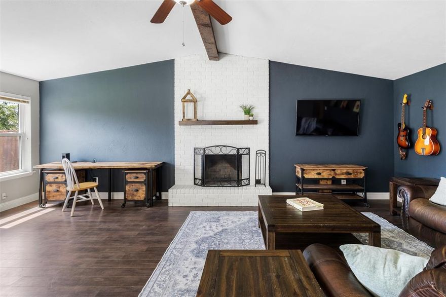 Welcome to this meticulously maintained and beautifully updated single-story ranch-style home in the heart of North Richland Hills. Perfectly positioned between Fort Worth and Colleyville, this home combines convenience, comfort, and style in one of the area’s most desirable and established neighborhoods. Step inside and you'll be greeted by stunning laminate wood floors, soaring vaulted ceilings, and a contemporary designer paint palette that brings a fresh, modern feel to every room. The kitchen is a true highlight, featuring granite countertops, a sleek decorative floor to ceiling tile backsplash, and an open layout that flows effortlessly into the dining and living areas—ideal for entertaining and everyday life.

This smart floor plan makes excellent use of space, offering just the right balance between open-concept living and private retreats. All three bedrooms are generously sized, with the master suite boasting a large walk-in closet and a layout that ensures maximum privacy. Natural light pours in through ample windows throughout the home, creating a bright and uplifting atmosphere, ideal for relaxation or working from home.

Step outside to a truly impressive backyard—spacious, grassy, and bordered by a handsome brick wall that offers additional privacy from the nearby North Richland Hills Early Care and Education Center. Whether you’re enjoying your morning coffee on the patio or hosting weekend get-togethers, the outdoor space is a standout feature. If you're looking for a low-maintenance, high-comfort home in a peaceful and welcoming community, this one checks all the boxes. Nothing beats seeing it yourself, so don’t miss your chance to own this North Richland Hills gem!