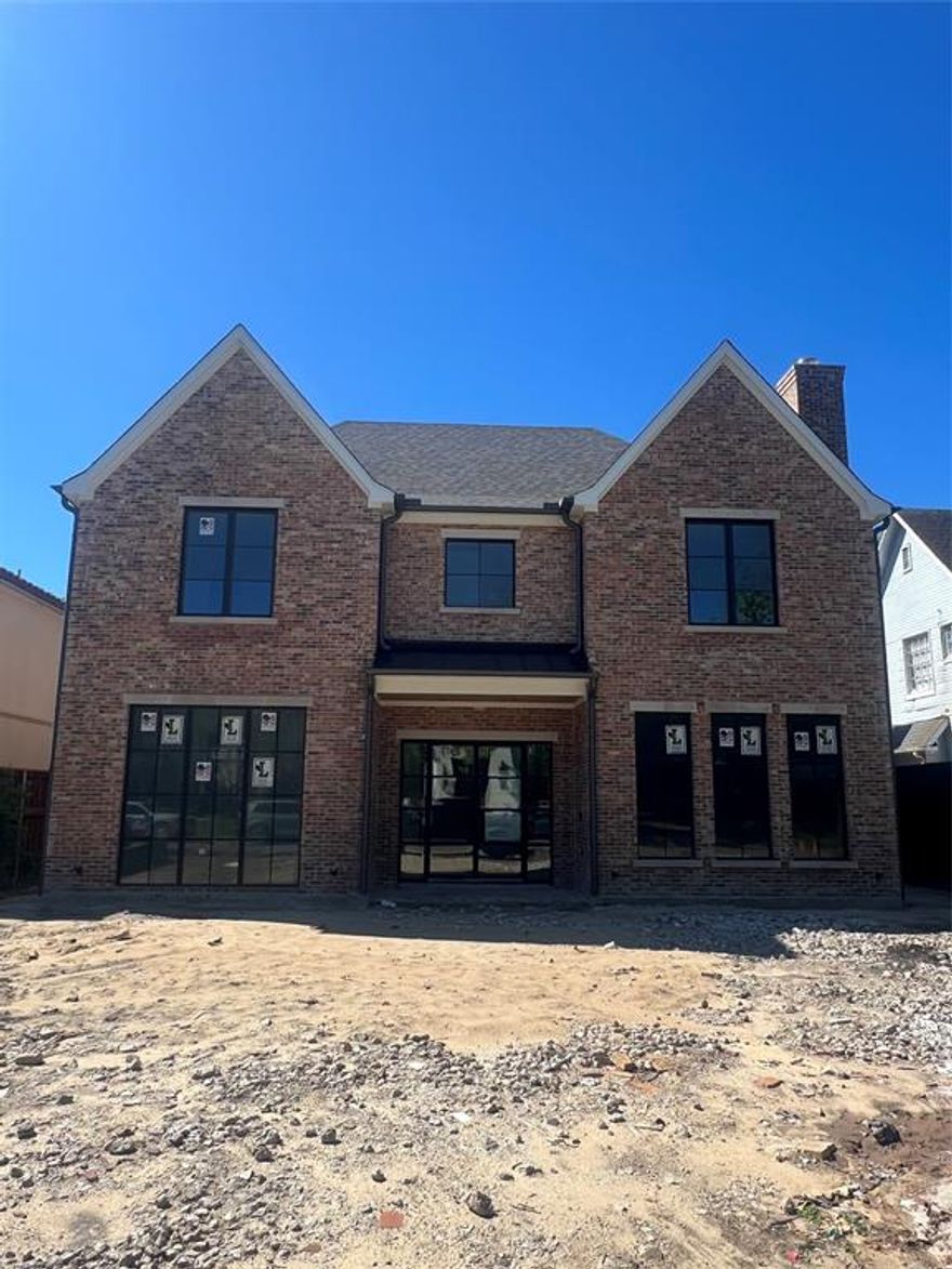 New Construction in highly sought after Highland Park ISD on a 60' wide lot. Expected Completion MAY 2026, available for showings now. This luxurious custom home, built by Schultz Custom Homes, boasts five bedrooms, five en-suite baths, and three half baths. This home features an open floor plan with a chefs kitchen, including top of the line Wolf and SubZero appliances, opens to both the breakfast area and living room, perfect for entertaining guests.  Oversized primary suite has white oak beams and a sitting area overlooking the backyard.  Covered patio with fireplace opens to backyard with room for a pool. Elegant primary bathroom with white oak cabinets, marble countertops, and a large walk in shower with dual shower heads.  Three secondary bedrooms each with en-suite bathroom and closet.  Large game room with bar area and laundry room complete the second floor.  Third floor has a bedroom or media room option complete with its own full bathroom.