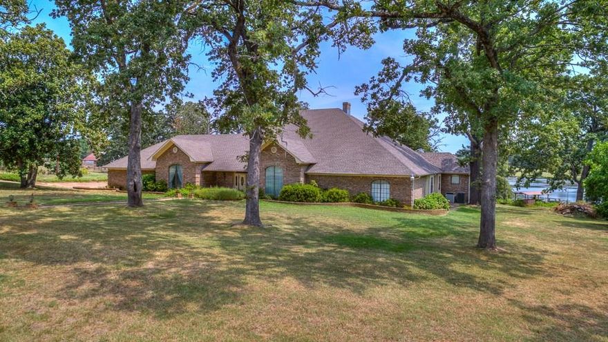 TALK ABOUT AN IMPECABLE RANCH WITH  354+- ACRES OF ROLLING LAND EXUDING THE BEST OF EAST TEXAS. This 5bed, 6bath, 2.5car garage, waterfront dwelling sits under a canopy of mature oaks on the crest of a subtle hill overlooking a scenic 18 acre stocked spring-fed lake. All bedrooms have suite full bathrooms with them. Property offers two additional dwellings, barn, holding pens and a deep well! This exquisite ranch is ready for cattle, horses, and more with cross fencing, 5 ponds, and 215 acres of pasture. Property embraces the natural beauty of the area and combines lush pastures, native hardwoods, and a unique quality of life. THIS FLAWLESS EAST TEXAS LAND IS A MUST SEE!