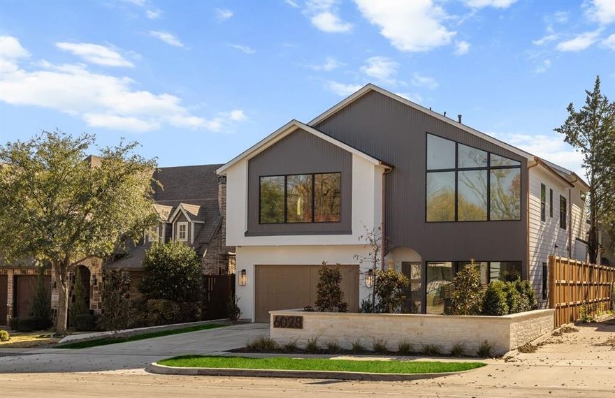 Exceptional new construction in a prime East Dallas location featuring a FULL 1,277 sq. ft. private guest quarters. Guest suite includes a full kitchen, laundry, one and a half baths, private entrance, and dedicated parking—ideal for a home office, guest suite, potential rental use, future pool house, or multigenerational living.
The main residence offers a thoughtful floor plan with a study and guest bedroom on the main level and three bedrooms upstairs, along with an upstairs media room featuring custom built-ins and a bar. The oversized primary suite includes a private living area, spa-inspired bath, and two walk-in closets.
Designer finishes throughout include white oak hardwood floors, commercial-grade appliances with a built-in Fisher & Paykel paneled refrigerator and Bertazzoni range, quartz countertops, white oak reeded kitchen cabinetry, and a statement vent hood. Architectural archways, natural stone accents, and wood beams add warmth and dimension. All bathrooms are uniquely designed with curated tile selections and custom finishes.
Floor-to-ceiling windows provide abundant natural light. Covered patio features a fireplace and wood-accent ceiling, creating an ideal indoor-outdoor living space. Oversized lot offers room for a pool and additional yard space. Quality Kenmare build located minutes from White Rock Lake, dining, shopping, and all East Dallas amenities.