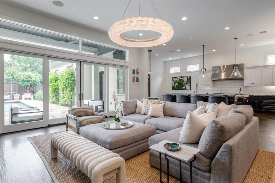 Welcome to this exceptional custom-built Martyn Hammer home in the highly desirable Briarwood neighborhood. Premier views of lush greenery as well as water jets soaring above a tranquil pool are enjoyed shortly after stepping through the door! An open floor plan features twelve-foot ceilings, RH fixtures throughout, hand-scraped wood floors and custom plantation shutters. The downstairs boasts a guest suite and marvelous dining room. The spacious kitchen curated by a chef flaunts a 60-inch Wolf range, commercial vent, built-in subzero fridge and freezer, dual ovens, two large islands each with their own sink, an oversized walk-in pantry and a cozy breakfast nook. The backyard exhibits a heated salt water pool and ample grill space curating the perfect oasis to effortlessly entertain as well as luxuriously relax. The upstairs showcases three bedrooms including a spacious primary suite. Encompassed by a cozy fireplace, the primary bedroom flows through to a spa-like bathroom with marble herringbone floors, dual marble vanities, and a large walk-in closet with a secured safe room. A spacious media room with walk-in storage closet is also nestled into the second floor. Multiple nooks are cradled into the home creating perfect spaces for many different zones ranging from a home office, Peloton station, homework setup or book nook. These different zones truly promote every square foot to be able to be utilized outside of traditional rooms. The house and backyard are equipped with Sonos audio. Garage with glass doors and epoxy floors faces a paved alley which can be accessed through a motorized gate. Home has electric charging both inside the garage and in the secured driveway. Briarwood is conveniently located in close proximity to Love Field, multiple luxury shopping locations and an ample variety of premier dining establishments. Come savor the peace and quiet of this beautiful neighborhood while enjoying all the luxurious elements this captivating home has to offer!