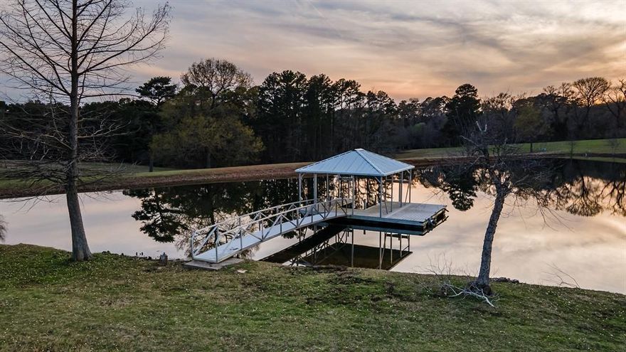 Welcome to this jaw dropping 173 acre EAST TEXAS RANCH! 2017 built 3BD 3.5BA 7,763 sqft home meticulously designed. Boasts fabulous great room, home theater, 2 living areas, mud room w dog wash. Open concept stone FP, gorgeous bar, gourmet kitchen w WOLF range, SS appliances, grilling room, massive island. Split primary en suite has kitchenette, coffee bar, spa like bath w shower, soaking tub. Guest bdrms w private bath. Oversized 2 car climate controlled garage with a pull through carport, UTV garage. Ready for livestock, includes working pens, arena, stables, tack room, barns, 2 stock ponds, 1 lake, 12,000sqft barn w studio, shooting range!! A few outdoor amenities..multiple water, fire features,rock garden, porch across the back of the house, few private patios. Breathtaking views of your lake, for watching geese and sunsets! There is a 3bd 2ba house on property with separate entry.This property has it all, don't miss out! 2 hours E of DFW. Less than 45 minutes to Tyler or Longview.