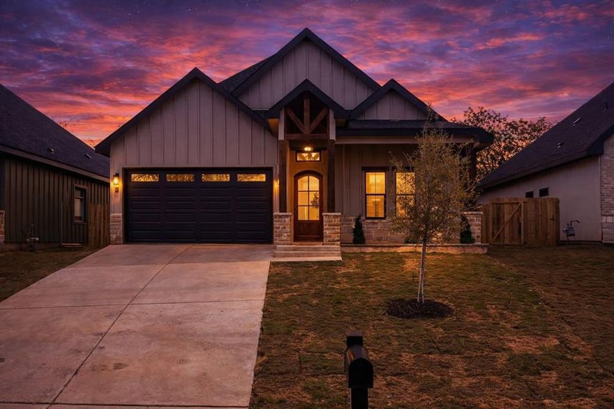 Beautiful new construction minutes from the Fort Worth Stockyards and Downtown. This 4-bed, 2-bath home offers 1,951 sq ft of thoughtfully designed living space with 10 ft ceilings throughout and an impressive 18 ft vaulted ceiling in the main living area. The open-concept layout features a spacious family room, large windows for natural light, and a floor-to-ceiling stone fireplace. The kitchen includes custom cabinetry, quartz countertops, a large island, built-in oven and microwave, gas cooktop, and vent hood. The primary suite showcases an 18 ft ceiling, 10 ft accent wall paneling, and a spa-style ensuite with a large walk-in tile shower, dual sinks, and an oversized walk-in closet. Secondary bedrooms are 12x10, offering flexibility for guests or office use. Additional features include a 2-car garage, brick and siding exterior, covered back patio, and a fully fenced backyard. Located close to major attractions, dining, and entertainment with easy access to I-35 and I-30. Move-in ready and built with quality finishes throughout.