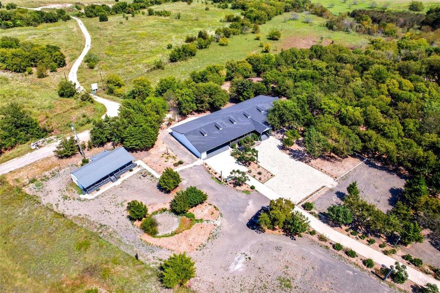 HOME SWEET HOME FOR THE HOLIDAYS! Whether you’re looking for a peaceful getaway, a vacation home or a property that blends tranquility with entertaining, this 10+acre estate is your perfect escape. Seller thoughtfully renovated this property with a perfect mix of rustic charm and modern conveniences. The main house exudes warmth and character, with upgraded finishes throughout. With multiple living areas, an open-concept kitchen, and large windows that bring in natural light, this home offers a welcoming and functional layout, ideal for family gatherings and entertaining. Updated Kitchen & Bathrooms: Enjoy modern fixtures and appliances that blend beautifully & creating a space perfect for cooking, relaxing, and enjoying time with loved ones. The combination of the remodeled main house, guest house, wrap-around porch, outdoor spaces, new concrete driveway and natural beauty makes this property an exceptional choice for anyone looking to enjoy Texas-style living in comfort and style. Don't miss out on this rare opportunity to own a piece of Texas paradise with ample space to create memories for years to come! Hurry send your offer TODAY & enjoy country living at its best!