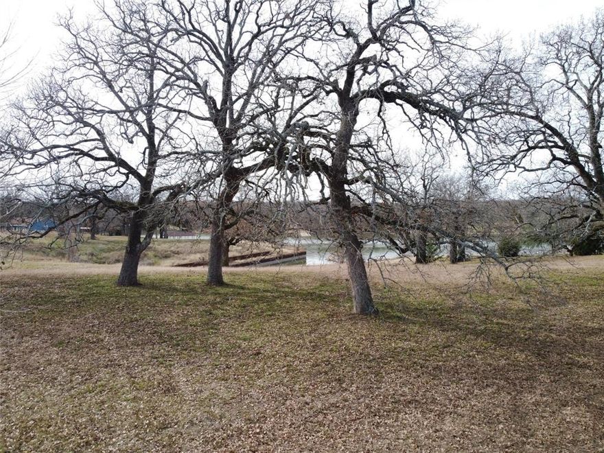 Here it is—the lakefront spot you've been dreaming about on Richland Chambers! Six connected lots, with one even reaching the metal bulkhead, make this the perfect place to build your home. The lot's been carefully cleaned up, leaving some beautiful, mature Post Oak trees. Tucked away in a peaceful, quiet neighborhood, it’s everything you’ve been looking for.