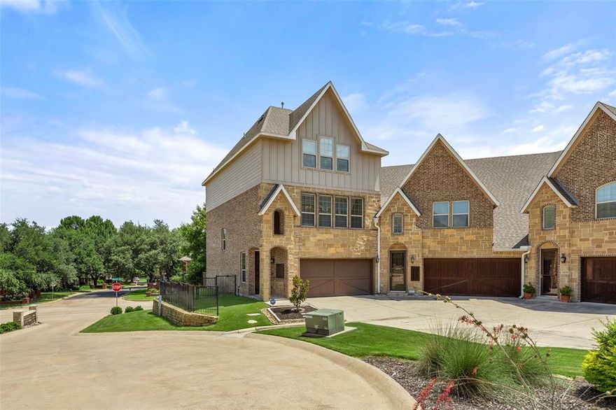 Experience refined living in this spacious and luxurious townhome, designed with both comfort and style in mind. This stunning residence is perfect for entertaining and everyday living. Enter through the two-car garage into a generous lower-level living space featuring a wet bar, two walk-in closets, and access to a covered patio, deck, and fenced backyard—ideal for hosting guests or enjoying quiet evenings outdoors. Upstairs, the bright, open-concept main level includes a stylish gourmet eat-in kitchen with granite countertops, stainless steel appliances, a gas cooktop, and custom white cabinetry with designer finishes. The oversized island flows into a spacious dining area and an inviting living room with a wall of windows and a cozy gas log fireplace. A huge walk-in pantry and nearby powder bath add both function and convenience. The expansive primary suite offers beautiful natural light, space for a sitting area, and a luxurious ensuite bath with double vanity sinks and new quartz counters, a soaking tub, separate shower, and a massive custom walk-in closet. Enjoy easy access to a nearby city park, miles of scenic trails for walking and biking, and the convenience of the Chisholm Trail Parkway, shopping, dining, and well-established neighborhoods with mature trees.