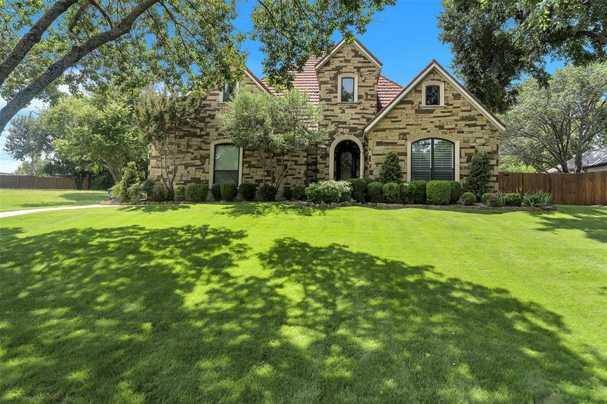 This gorgeous 4 bedroom 3.5 bath home is located in the secluded and highly desirable gated neighborhood of Crestpoint. This home has charm and is nestled on approximately a half-acre. From the welcoming entrance to the 5-star backyard with a large sparkling salt pool with spa and fountain features and large patio area, this home has it all- class, elegance and charm! The primary bedroom is located on the first floor. The primary bath has a large walk-in shower and large walk-in closet. The drawers under the sinks have custom pull out drawers and there is even a chandelier over the soaking tub.  There is a view of Eagle Mountain Lake across the street from the Primary bedroom and the front of the house. The floorplan is very welcoming with the kitchen open to the living room and all secondary bedrooms are upstairs. The 4th bedroom has lots of closet storage and is currently used as a media room. New Solar Smart II Argon insulated windows were installed throughout the house in November of 2024.  The home has a generator that runs on propane. There are 2 propane tanks on the property. Show this home to your pickiest clients. They will be impressed! This is the perfect entertaining home and is ready for its new owners to love and enjoy!