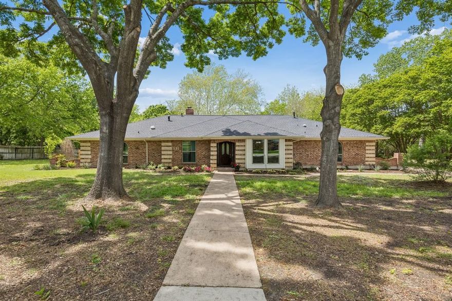 RARE OPPORTUNITY!  ONE ACRE*WOODED CREEK LOT*POOL & SPA*NO HOA. This one story gem is nestled among mature trees in Fairview’s coveted Ranchette Estates. The functional floorplan  includes 4 bedrooms, 3 full baths, 2 living and 2 dining areas. Contrubuting to the charm & character of this home are features such as wood beams & a stunning stone fireplace wall in the family room, wood burning stove in the den, beadboard ceiling in the kitchen, French doors in the dining room and built in shelves & cabinets throughout. The eat-in kitchen boasts granite countertops, SS appliances and ample cupboard & counter space. The primary suite is large enough for king size furniture, has an ensuite bath, walk-in closet and access to the outdoors. The cozy den is perfect for family time, game nights or entertaining friends. The expansive backyard is the crown jewel of this home. Enjoy the lush wooded backdrop, relax on the covered patio, cool off in the sparkling pool, cozy up around the firepit, or sit quietly by the creek. A generous workshop with electric power provides storage space for lawn equipment, bicycles, toys and tools. An attached, covered carport has room for 3 cars and the long driveway provides additional space for larger vehicles. Experience the peaceful privacy and beautiful views this home has to offer while the convenient location puts you minutes from shopping, dining, professional services, medical facilities, Hwy 75, Hwy 121 & Hwy 5. A must see!