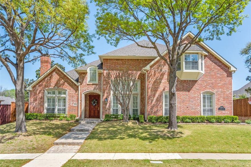 Nestled in the prestigious Shoal Creek community of West Plano, this stunning luxury home offers elegance, comfort, and an unmatched location. Set across from a peaceful park and lake on a generous 0.34-acre lot, the home welcomes you with a grand foyer filled with natural light and warm hardwood floors that flow through the main living areas of the first level. Plantation shutters, tall ceilings, and custom touches add timeless sophistication. The formal dining room is perfect for entertaining, while the formal living room features a gas fireplace and built-in shelving, creating a space that feels both refined and inviting. The totally updated kitchen is a showpiece, featuring expansive countertops, a large island, a farmhouse sink, sleek stainless appliances including a five-burner gas cooktop, and abundant cabinetry. A walk-in pantry and butler’s pantry with glass-front cabinets and a wine fridge add both function and flair. The breakfast nook opens to a bright, open-concept family room with a wall of windows overlooking the lush backyard. Built-ins flank the gas fireplace, adding warmth and charm. The main-level primary suite is a private retreat with a tray ceiling, sitting area, and backyard views. The en-suite bath includes granite vanities, a garden tub, a separate shower, an oversized walk-in closet, and a cedar-lined closet. A flexible guest suite doubles as a workout room, with a full bath that also serves as a pool bath. A private study, spacious laundry room, and mudroom complete the first floor. Upstairs, a generous game room is surrounded by three additional bedrooms with built-ins, walk-in closets, and access to Jack-and-Jill or private baths. The backyard is a true escape, with a saltwater pool, spa, waterfall, covered patio, and grassy lawn. With two staircases, a three-car garage, and access to trails and parks, this home blends luxury and livability in one of Plano’s most desirable neighborhoods.