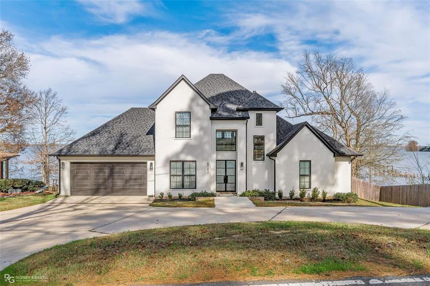 Stunning 2023 Custom-Built Lakefront Home on Cross Lake

This exceptional 3-bedroom, 2.5-bath custom home, built in 2023 by HUDCO Construction, offers modern luxury living with breathtaking front-row views of Cross Lake. From the moment you enter, you’re greeted by soaring ceilings and an abundance of natural light pouring through the massive lake-facing windows.

The open living area showcases engineered hardwood floors, a dramatic ceiling height, and panoramic views that make the lake feel like part of your living space. The gourmet kitchen features stainless steel appliances, quartz countertops, and a matching quartz backsplash for a clean, modern look.

The primary suite is conveniently located on the first floor, offering privacy and comfort with direct access to the main living areas. Also downstairs is a guest half bath, perfectly positioned for visitors. A first-floor office provides a flexible-use space ideal for working from home, a playroom, or an additional sitting area.

Upstairs, the thoughtful design continues with spacious secondary bedrooms and beautifully finished full bath. Step outside to enjoy unforgettable sunsets from the large elevated back porch overlooking Cross Lake, perfect for entertaining, relaxing, or taking in the peaceful waterfront setting.