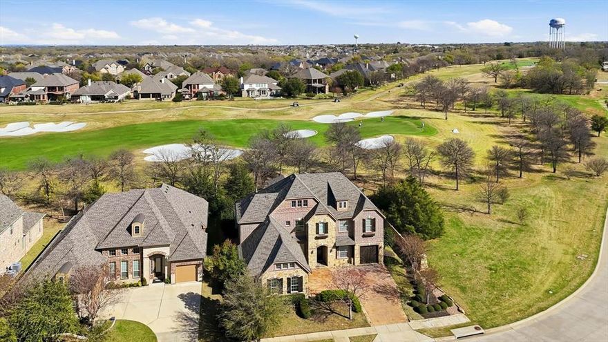 Previous Model Home on the golf course with park-like backyard offers luxury living for your growing family. This Large 5 bedroom 4.5 bath stone and brick home offers many extensive comforts and finishes that only a model home can.  The open floor plan has a great feel with plenty of natural sunlight is provided via the floor-to-ceiling windows. The connected views to the pool and covered patio are great for entertaining with family and friends.  New roof, gutters and much more have been added just for you! The views onto the golf course feel like an extension of the backyard.  Spacious room and warm finishes, woods and paint tones make for easy decorating.  This home is ready for move-in and won't last long.   Lantana is an award-winning master planned community and offers plenty of things to do with its community center, fitness center with tennis and paddle ball areas.  If golf is your game, Lantana's semi-private clubhouse and course is both fun and challenging.  Local restaurants and easy access to highways  are within minutes of this executive home. Don't forget DFW Airport is 20 minutes away!   Come and see!