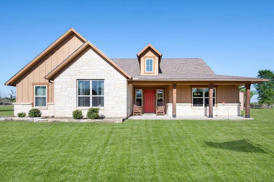 Welcome to your peaceful country retreat in Kerens, Texas! This beautifully maintained 3-bedroom, 2-bath home offers approximately 2,000 square feet of comfortable living space, perfectly situated on 6 scenic acres just minutes from Richland Chambers Lake. Inside, you’ll find a spacious open layout featuring a large kitchen with granite countertops, an oversized island ideal for gathering, and a seamless flow into the living area. Hardwood floors and tile run throughout the home, combining durability with timeless style. The cozy living room is anchored by a charming fireplace, creating the perfect space to relax and unwind. Step outside and take in the breathtaking countryside views from both the covered front and back patios. The backyard is designed for entertaining, complete with an additional deck and a firepit—perfect for evenings under the stars. The fully fenced yard provides privacy and plenty of room for pets or outdoor activities. Additional features include a detached 2-car garage and a versatile shed with an attached carport, offering extra space for parking, storage, or equipment such as a mower or tractor. For those looking to expand, an adjacent 6-acre lot is also available for purchase, presenting a rare opportunity to create an even larger homestead or investment. Enjoy the tranquility of a quiet, peaceful neighborhood while still being close to lake recreation and local amenities. This property truly offers the best of country living with modern comforts!