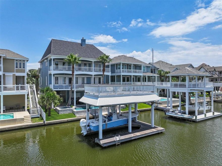 Enjoy southerly breezes & glimpses of the bay from this canal front home in sought after Laffites Cove. This spacious and efficient floor plan offers a rare 5 bedrooms with 2 living rooms, elevator, outdoor kitchen and swimming pool! The kitchen has been updated with quartz countertops & painted cabinets. Engineer wood floors flow throughout the home. Built-ins can be found in both living areas & all bedrooms. Over 2,400 sq ft of covered & uncovered decks on 2 levels. Storm shutters over windows and doors. This well maintained home has had several improvements over the years including swimming pool, freshly painted exterior, 2 new water heaters, new roof, garage door, new living room furniture, new decking & support, fencing, new bar, landscaping & more! See full list of improvements with dates. Home conveys furnished with exclusions.